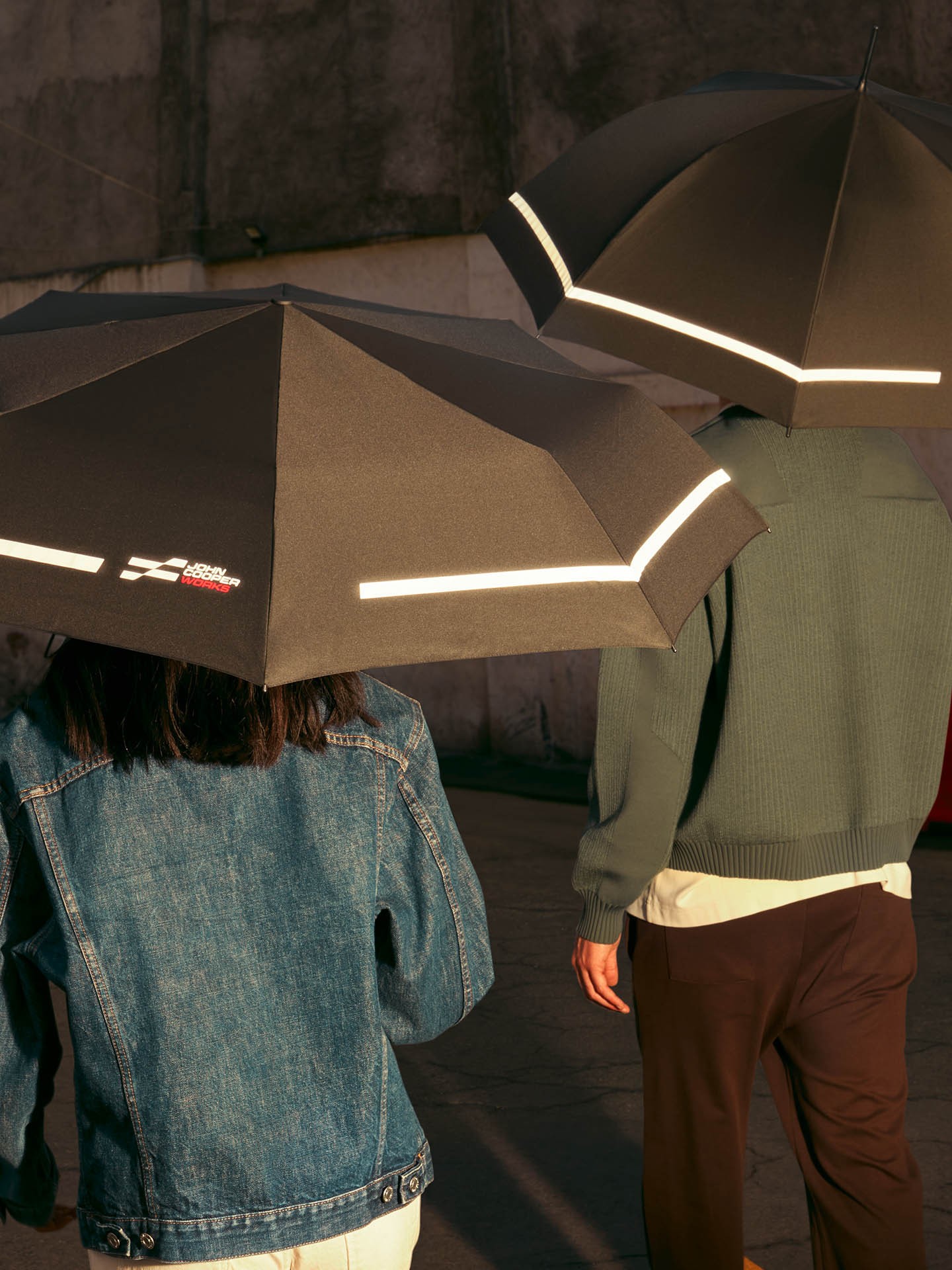 Models with black JCW umbrellas